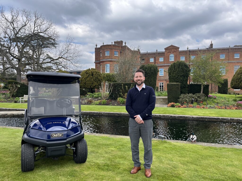 Brad Gould, The Grove’s Director of Golf, standing in front of the mansion at the venue, with one of the resort’s new Club Car Tempo cars,